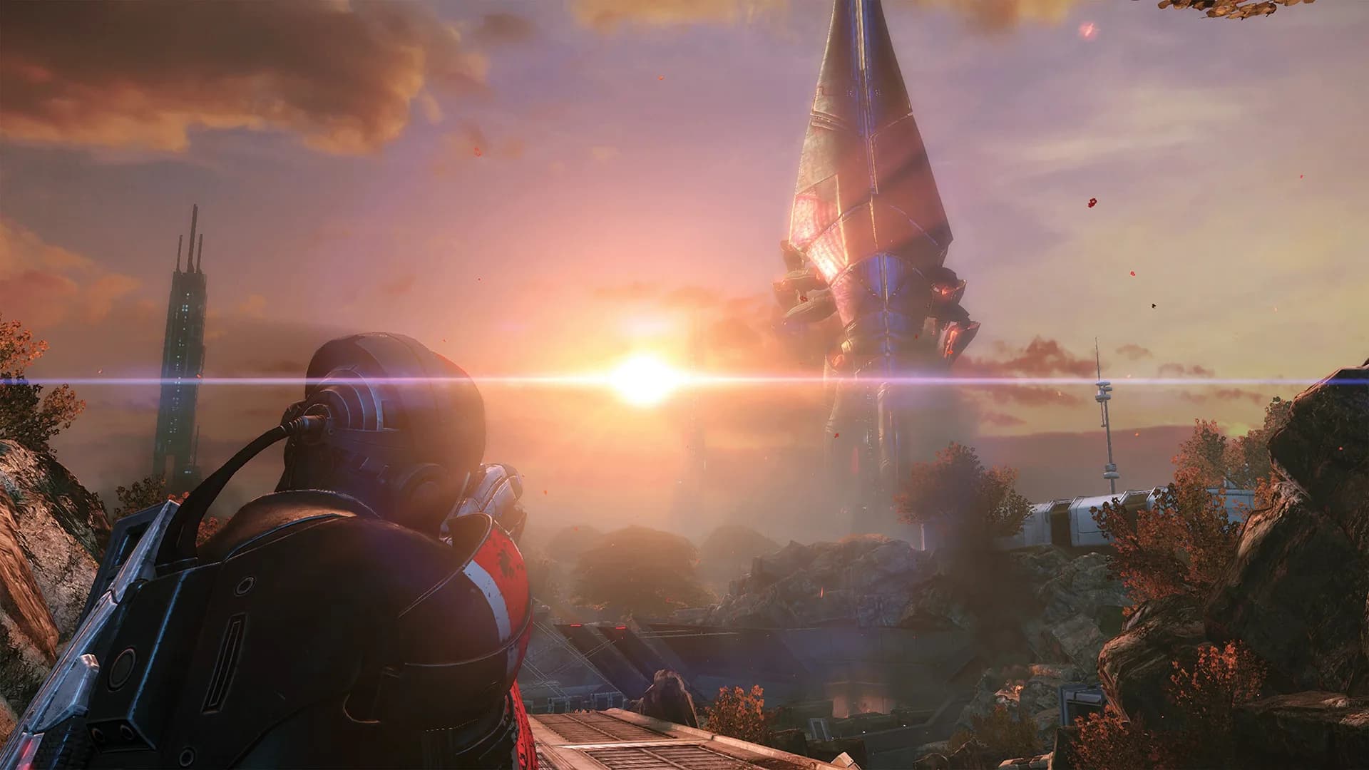 BioWare'in geliştirdiği Mass Effect Legendary Edition'dan bir sahne, Komutan Shepard gün batımında uzaktaki kuleye bakıyor